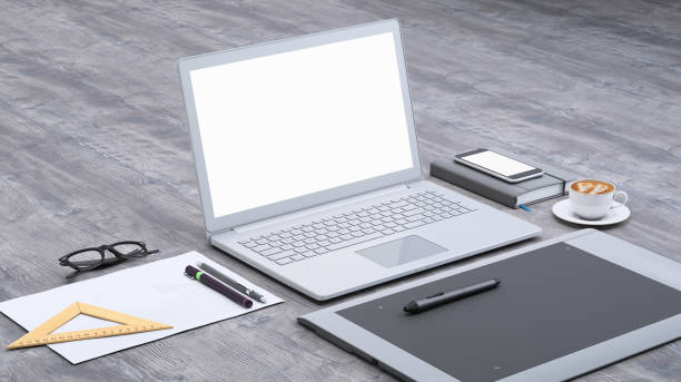 istock Laptop on a desk with graphic tablet, blank screen mock-up isometric 955345998