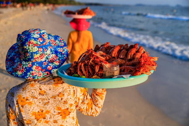 Cambodian women selling fresh lobsters on the beach, Sihanoukville, Cambodia Happy Cambodian women selling fresh lobsters on the beach, Sihanoukville, Cambodia cambodia food stock pictures, royalty-free photos & images