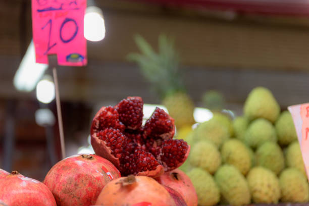 Pomegranate and pineapple on sale in market