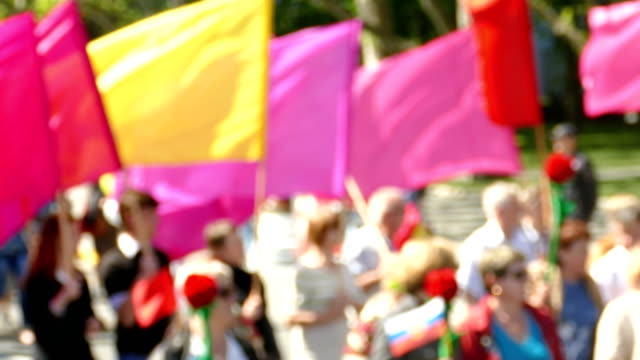 background - crowd of people with flags - defocused