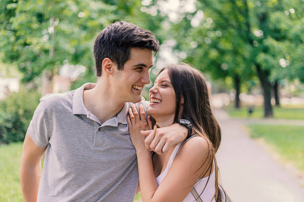 istock Happy couple in love having fun outdoors and smiling. 955366786