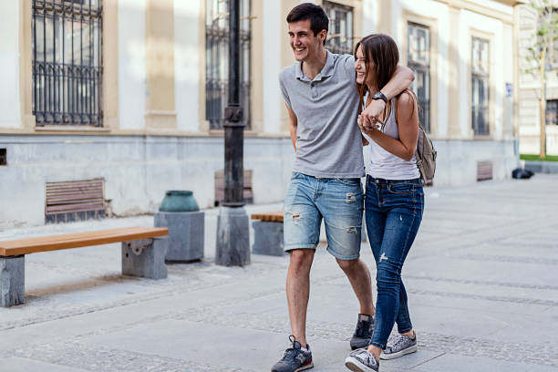 istock Happy couple in love having fun outdoors and smiling. 955367202