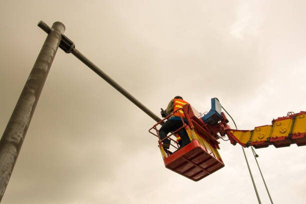 istock people is working on crane for install new traffic ligh 955371716