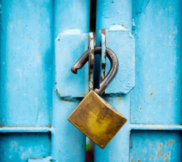 istock key lock old stitched in the blue door. 955376236