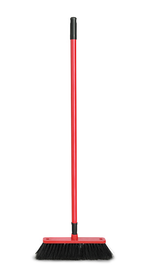 Red plastic broom isolated on white