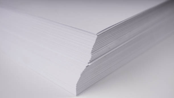 istock Stacks of white plain paper on white background 955379692