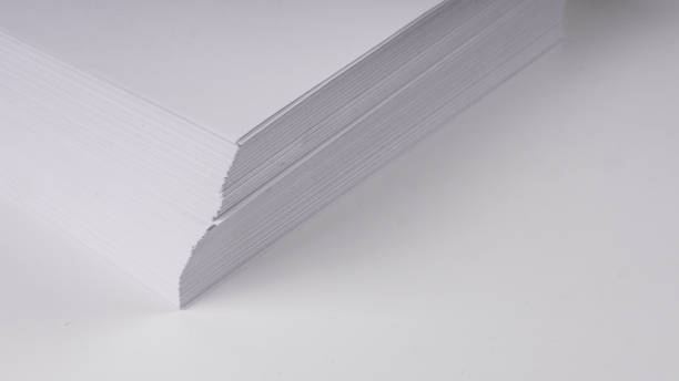 istock Stacks of white plain paper on white background 955379766