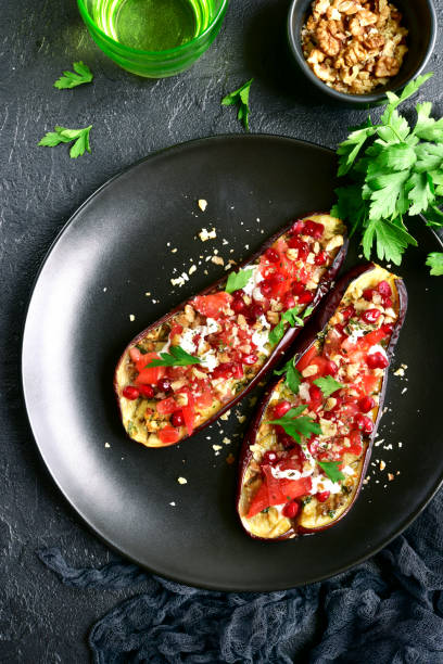 istock Grilled eggplant stuffed with tomatoes, nuts, pomegranate and yogurt dressing 955392688