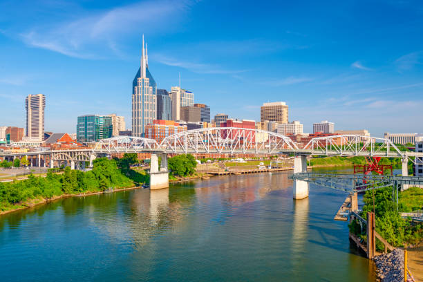 Nashville, Tennessee, USA Skyline Nashville, Tennessee, USA downtown city skyline on the Cumberland River. nashville tennessee bridge stock pictures, royalty-free photos & images