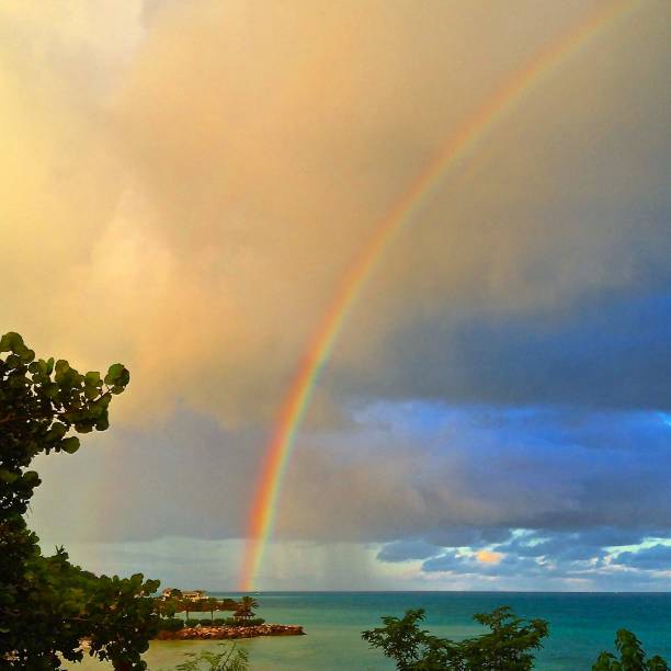 istock Afternoon shower beautiful rainbow 955403522