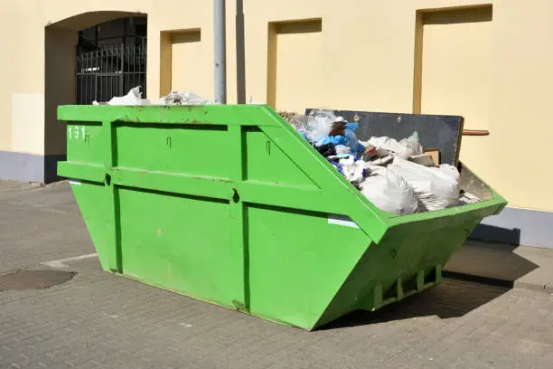 Photo of Green skip (dumpster) for municipal waste
