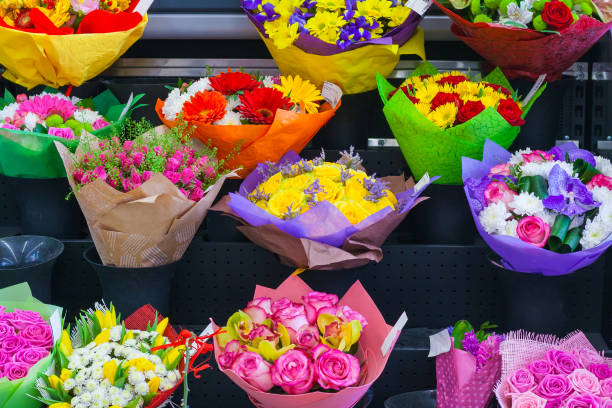 istock Multicolored bouquets in wrapper in the flower shop 955417500
