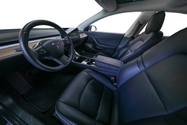 Interior cabin of a Teala Model 3 Miami, FL, USA - May 4, 2018: Interior photo of the new Tesla Model 3 all electric vehicle with black leather seats tesla model 3 stock pictures, royalty-free photos & images