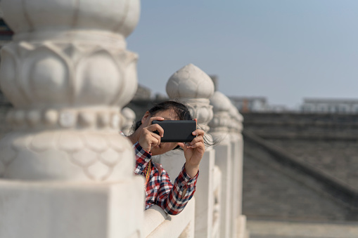 girl traveling in Chinese ancient architecture