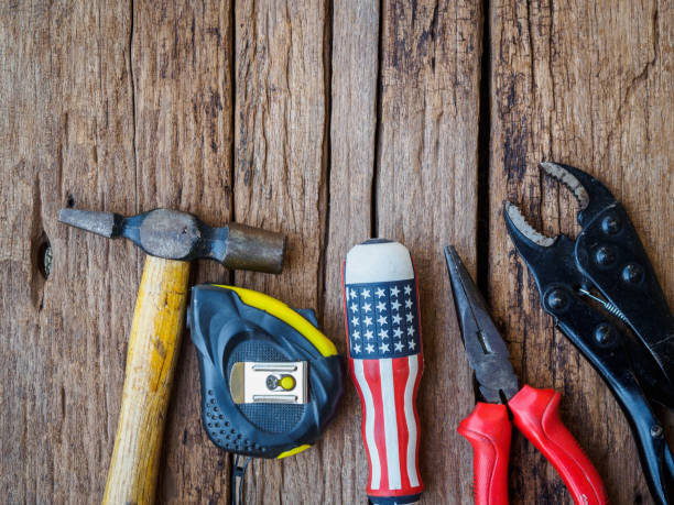 istock Joinery tools and paper on a wooden table texture background. Labor day concept. 955439430