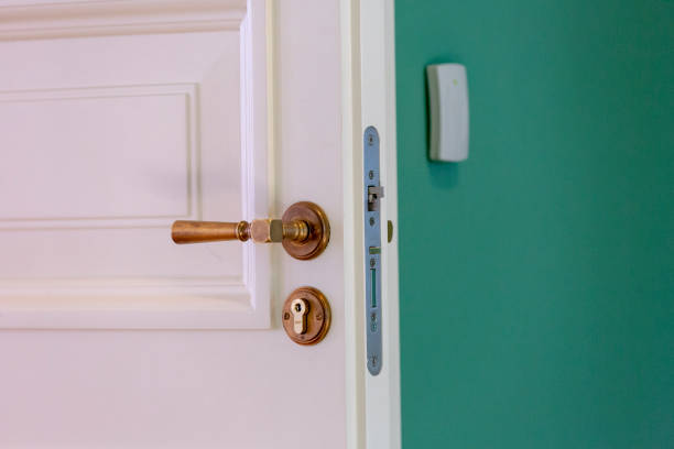 istock White Wood Door with Ornate Baroque-Style Handle 955440050