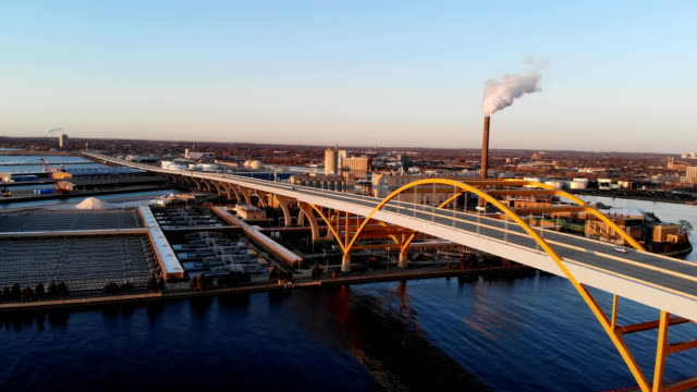 Aerial view of american city at dawn. Вuildings, factory, bridge, bay.  Sunny morning. Milwaukee, Wisconsin, USA