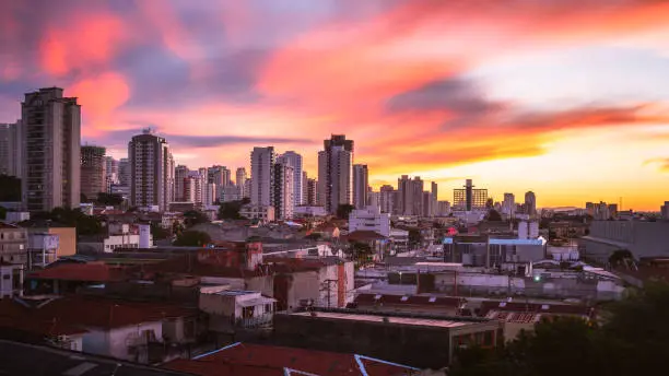 An amazing and colorful urban sunset taking place in West side of São Paulo. Água Branca, São Paulo.
