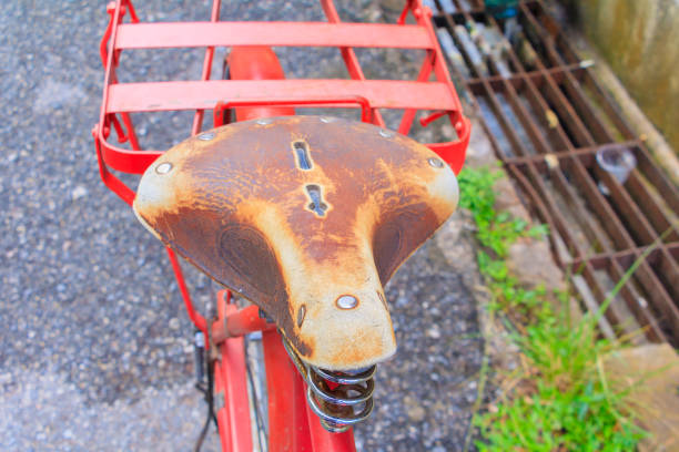 istock Close up  leather saddle bicycle red classic vintage in former beautiful with copy space for add text 955445024