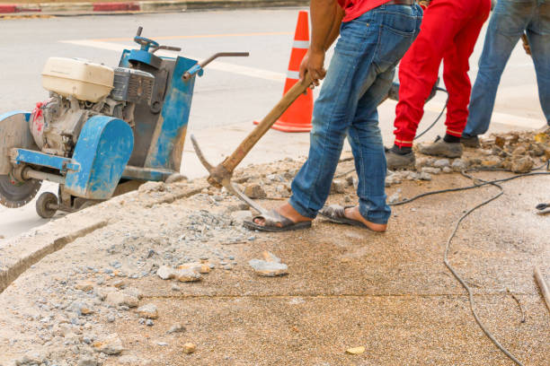 istock construction drilling repair worker on road surface with heavy duty machine drill motion 955445358