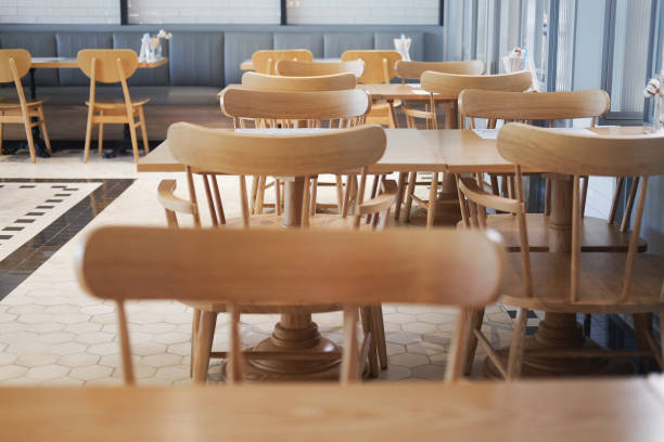 istock Wooden elegant tables with chairs crate pleasant atmosphere 955449554