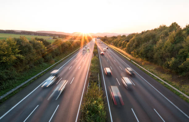 istock The road traffic on a motorway at sunset 955454592