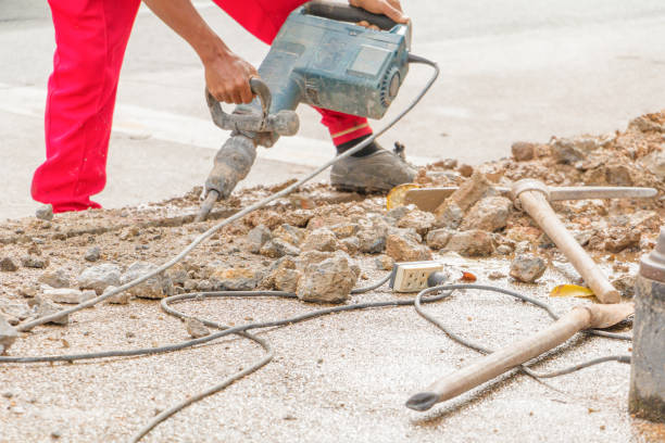 istock construction drilling repair worker on road surface with heavy duty machine drill motion 955458716
