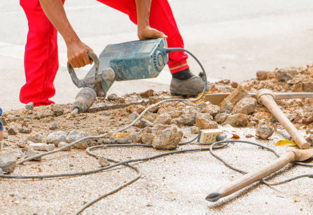 istock construction drilling repair worker on road surface with heavy duty machine drill motion 955458756