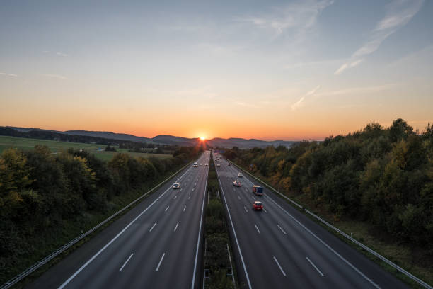 istock The road traffic on a motorway at sunset 955458878
