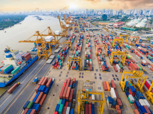 istock Logistics and transportation of Container Cargo ship and Cargo working crane bridge in shipyard 955468368