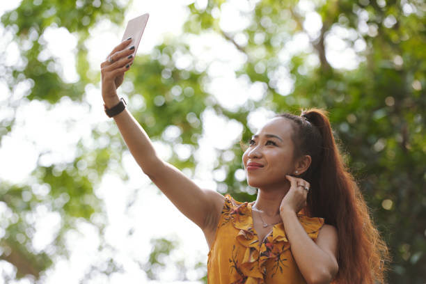 istock Photographing young woman 955487230