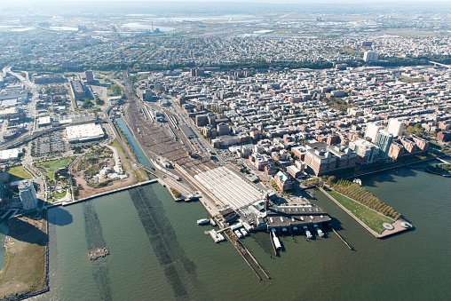 Stunning aerial view of Hoboken, New Jersey, including the PATH station and the railyards from a helicopter.