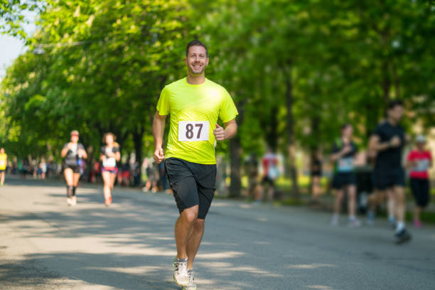 istock smiling man on charity run 955495086