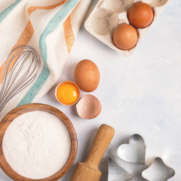 istock Ingredients for baking  - flour, wooden spoon, rolling pin, eggs. 955501406