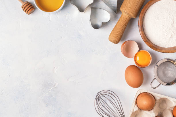 istock Ingredients for baking  - flour, wooden spoon, rolling pin, eggs. 955501416
