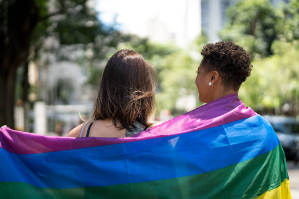 istock Lesbian Couple with Rainbow Flag 955501954