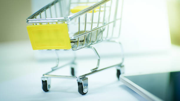 istock cart with coin in business concept. 955502576