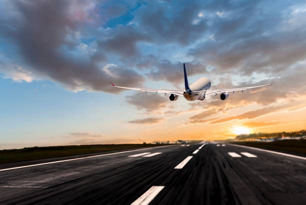 istock Passenger airplane taking off at sunrise 955506478