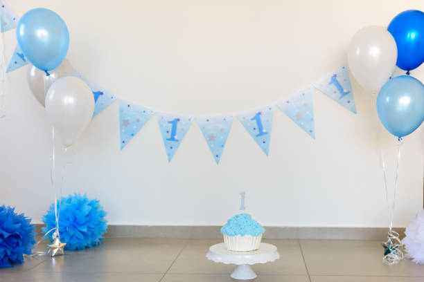 istock First birthday party decorations and cake 955510070