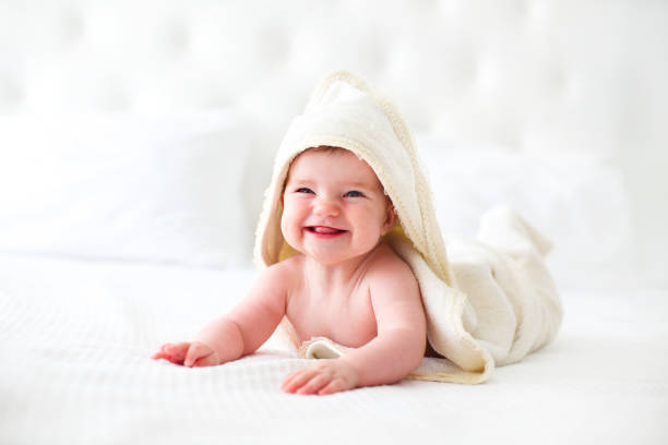 istock Six month baby wearing towel after bath 955514752