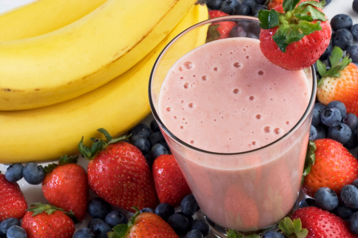 Smoothie surrounded by fruit