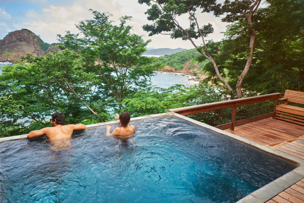 istock Young couple staying in pool 955529742