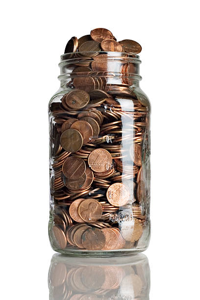 Jar full of pennies stock photo