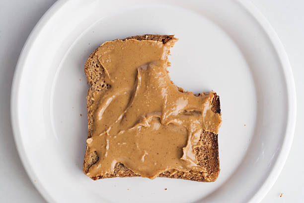 Peanut butter on bread stock photo