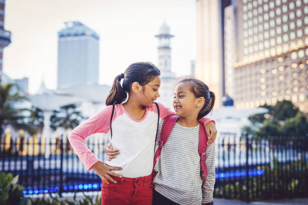 istock Malaysian sisters playing after school 955538264