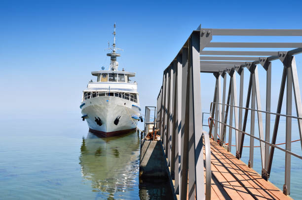 istock White ship on sea waves against the blue sky 955538306