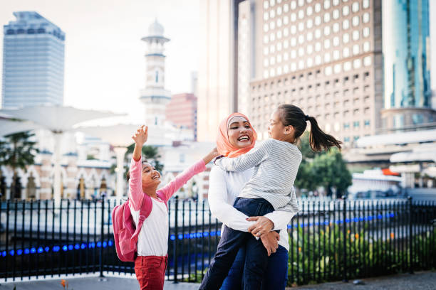 istock Malaysian mother playing with two school kids 955542500