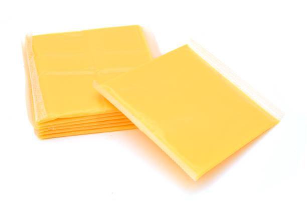 istock Slices of processed American cheese on white background 955548928
