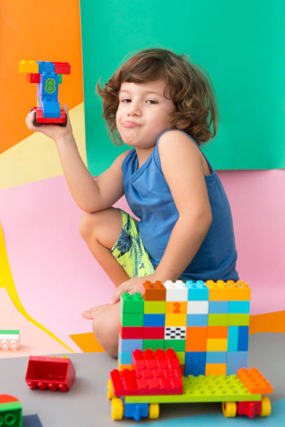 istock Happy child playing with Preschoolers Building Blocks 955551854