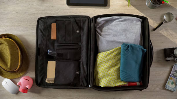 istock Tourists suitcase packed carefully for travel, going on trip, summer vacations 955555122